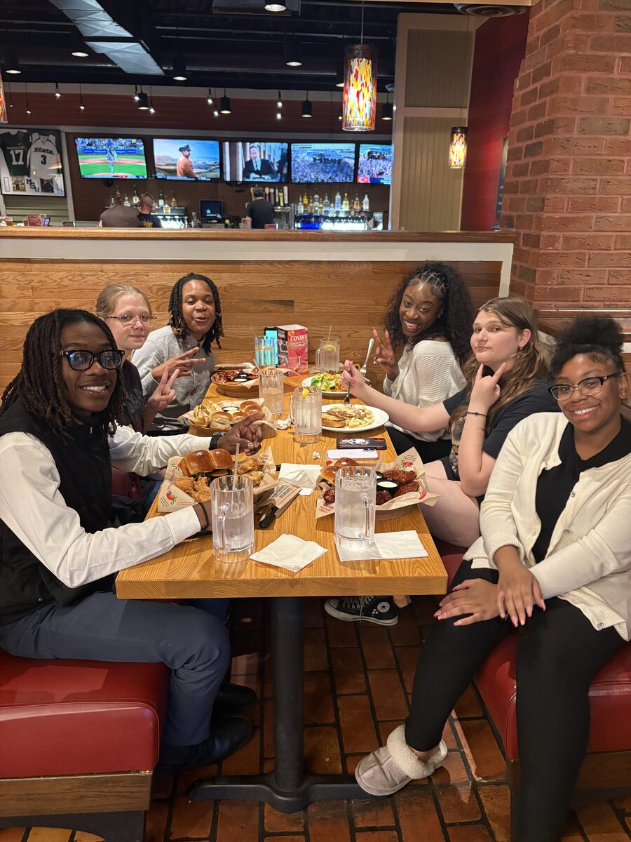 Intuitive Career Solutions team members gathered around the table at a team dinner