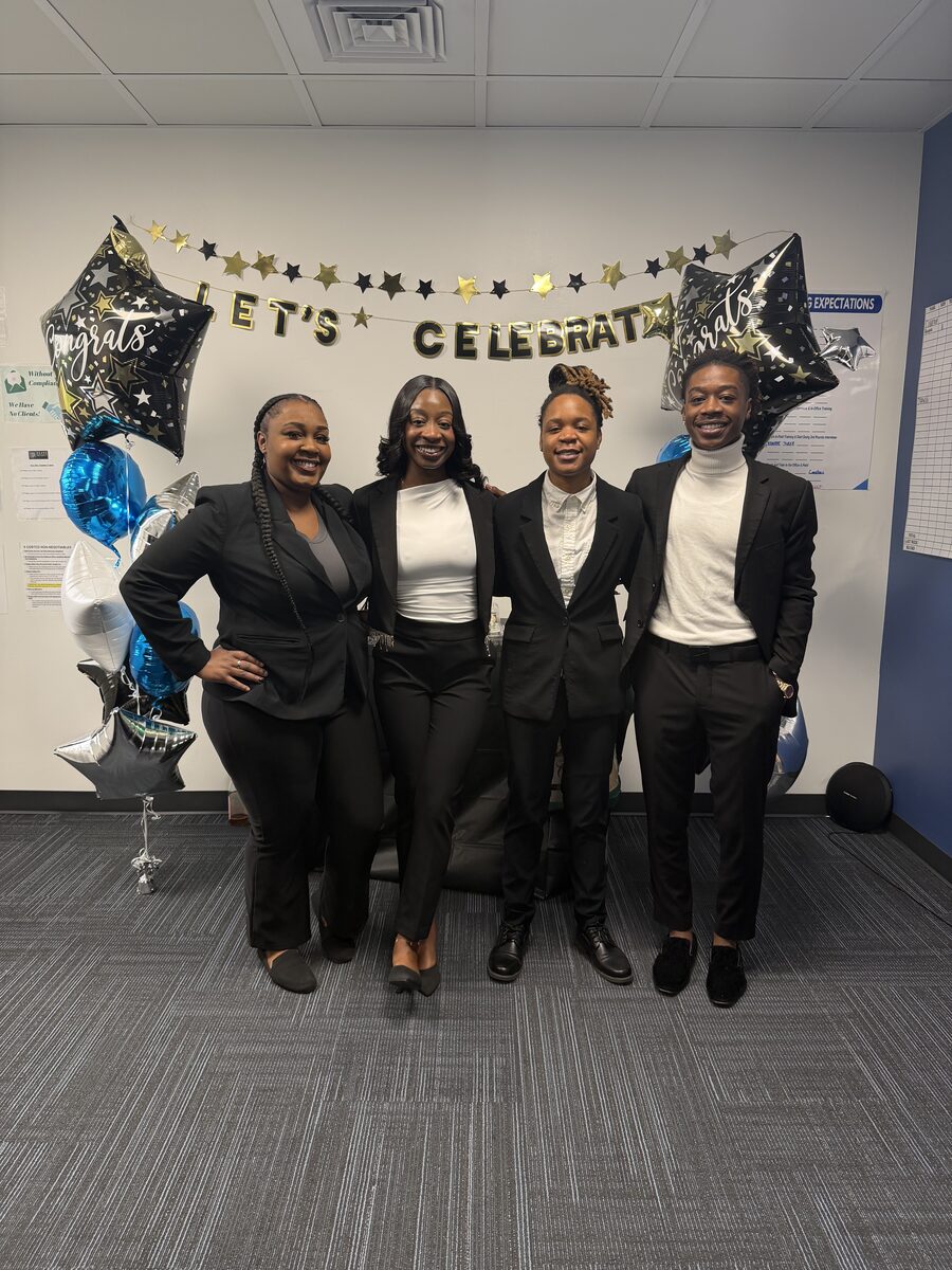 Intuitive Career Solutions team members celebrating a milestone together in the office
